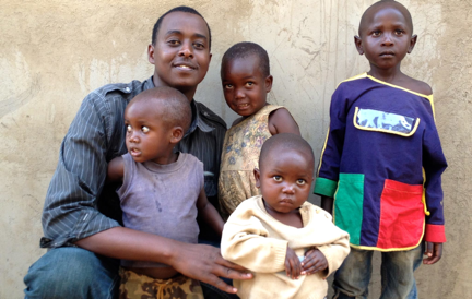 Pictured above: RC Founder, Serge Gasore, Jr., with some of our Rwandan children.